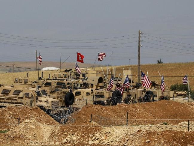 Vehicles of US-backed coalition forces in the northern Syrian town of Manbij. Picture: AFP