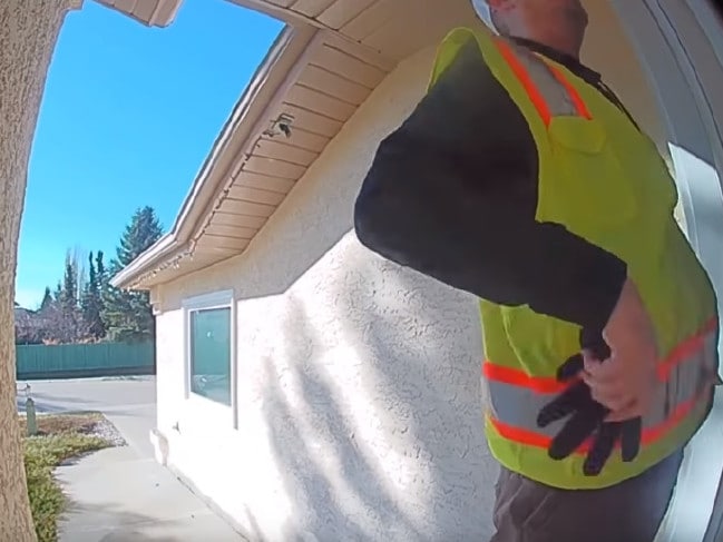 The man pulls out a glove before trying the lock. Picture: YouTube